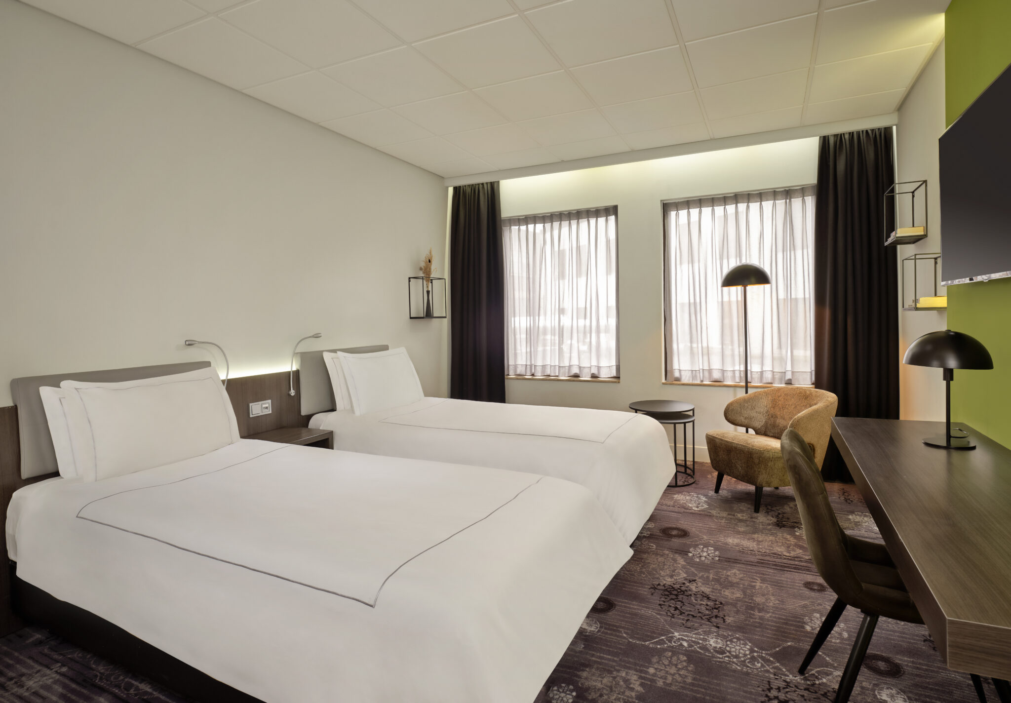 Park Plaza Eindhoven superior twin room with beds, window view, lounge chair, desk and TV